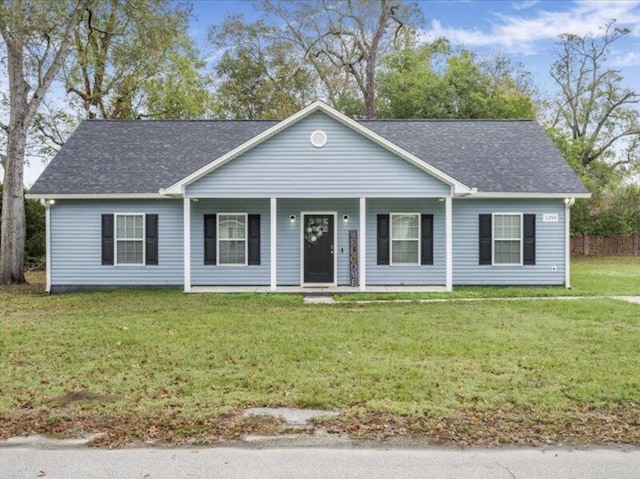 single story home featuring covered porch and a front lawn