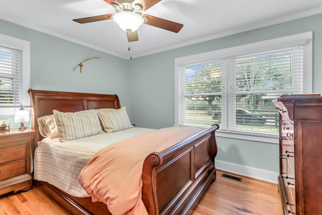 1416 Glencoe Dr, Mount Pleasant, SC 29464 - bedroom featuring multiple windows, light wood-style flooring, crown molding, and baseboards