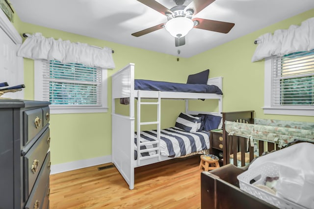 1416 Glencoe Dr, Mount Pleasant, SC 29464 - bedroom featuring multiple windows, light wood-type flooring, and baseboards