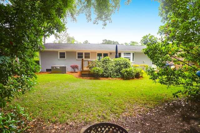 1416 Glencoe Dr, Mount Pleasant, SC 29464 - rear view of property featuring brick siding, a yard, a deck, and central AC