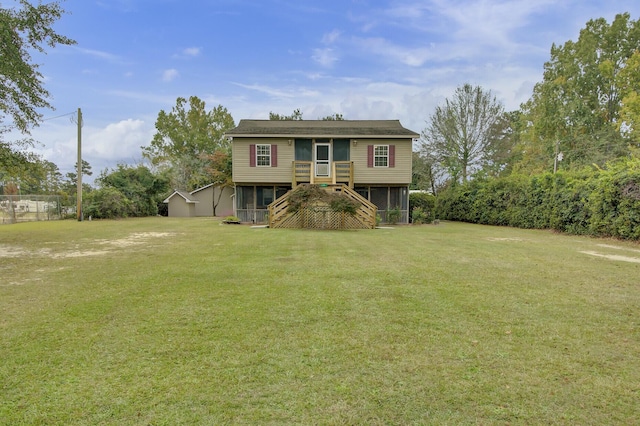 view of front of house with a front lawn and a sunroom