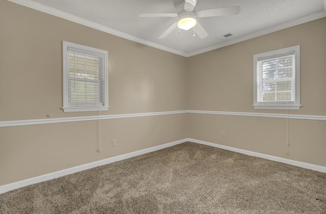 carpeted empty room with a textured ceiling, ceiling fan, and ornamental molding