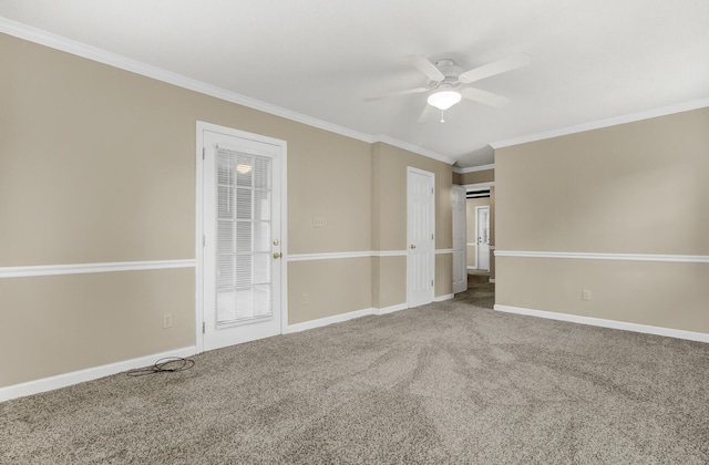 carpeted spare room with ceiling fan and ornamental molding