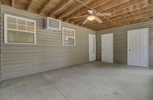 interior space featuring ceiling fan and a wall mounted AC