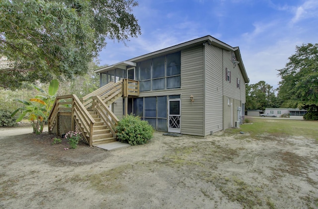 back of property featuring a sunroom