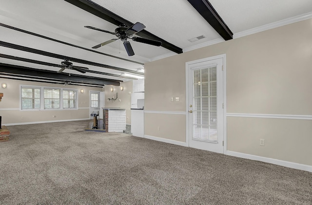 unfurnished living room featuring beam ceiling, crown molding, carpet, and ceiling fan