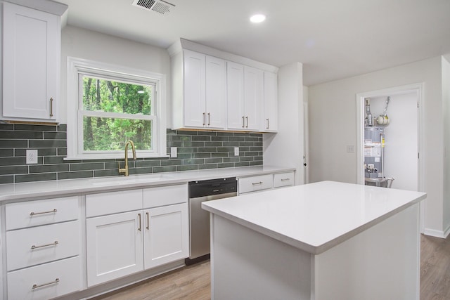 3231 Stonehaven Dr, North Charleston, SC 29420 - kitchen with a sink, dishwasher, gas water heater, light countertops, and recessed lighting