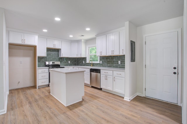 3231 Stonehaven Dr, North Charleston, SC 29420 - kitchen featuring appliances with stainless steel finishes, tasteful backsplash, white cabinets, light wood-type flooring, and recessed lighting