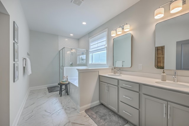 full bathroom featuring visible vents, marble finish floor, a stall shower, and a sink