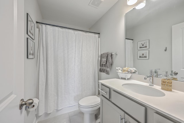 full bathroom with tile patterned flooring, visible vents, toilet, vanity, and shower / bathtub combination with curtain