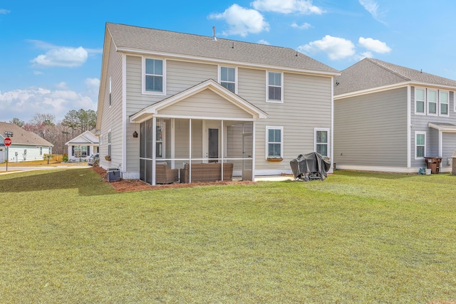 back of property featuring central air condition unit, a yard, and a sunroom