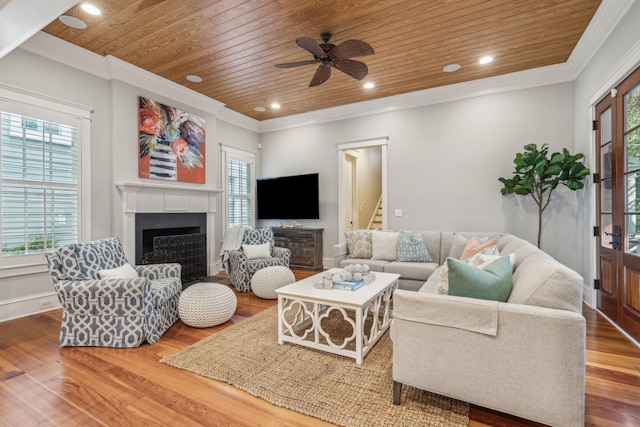 living room with wood ceiling, a healthy amount of sunlight, and hardwood / wood-style floors