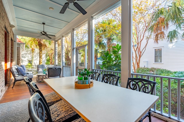 sunroom / solarium with ceiling fan