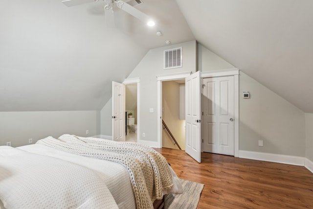 bedroom featuring ceiling fan, wood-type flooring, and lofted ceiling