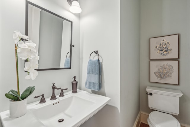 bathroom with sink and toilet