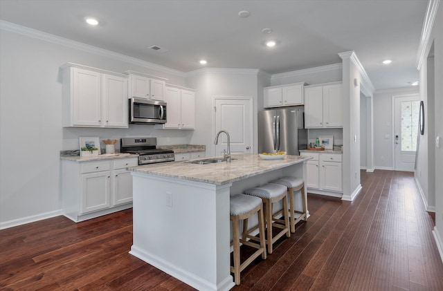 kitchen featuring a sink, white cabinetry, appliances with stainless steel finishes, and dark wood-style flooring