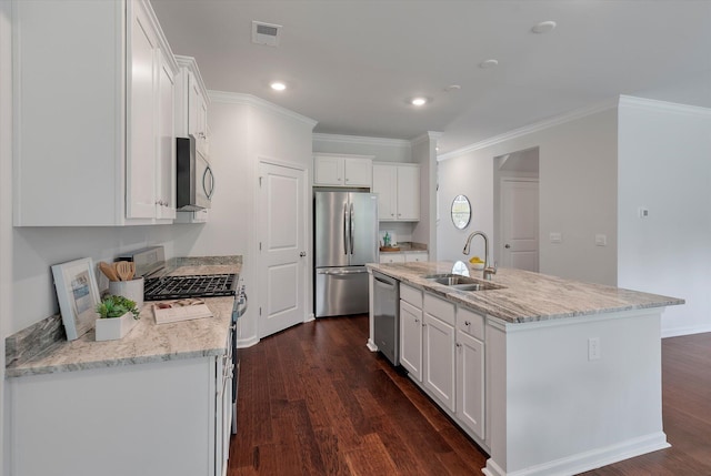 kitchen featuring white cabinetry, stainless steel appliances, a sink, and visible vents