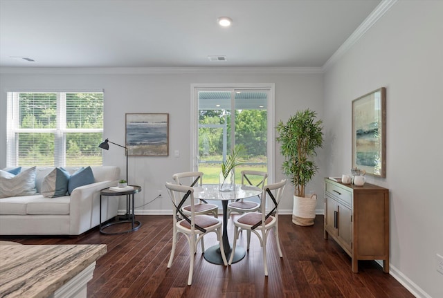 dining space featuring baseboards, ornamental molding, visible vents, and plenty of natural light