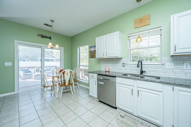 kitchen with a wealth of natural light, sink, decorative light fixtures, dishwasher, and white cabinetry