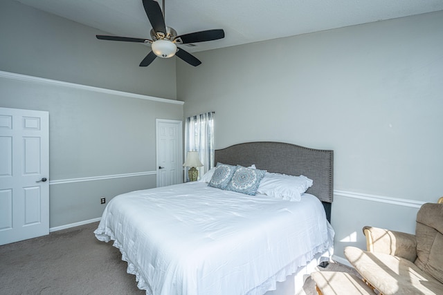 carpeted bedroom with a high ceiling and ceiling fan