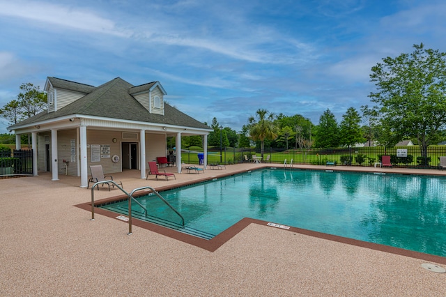 view of swimming pool with a patio