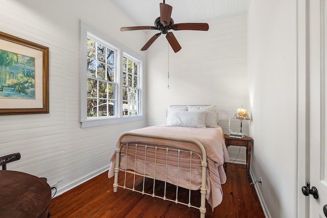 bedroom featuring dark wood-type flooring and ceiling fan