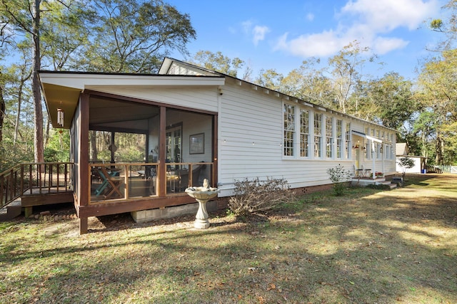 rear view of house with a lawn