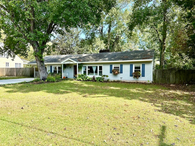 ranch-style home with a front lawn