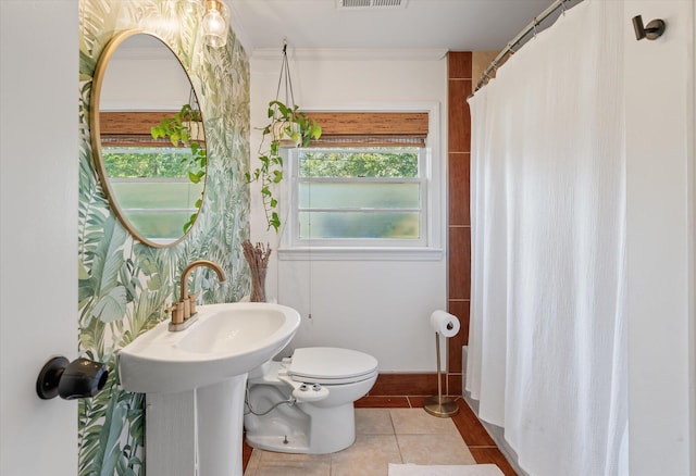 bathroom with sink, tile patterned flooring, ornamental molding, and toilet