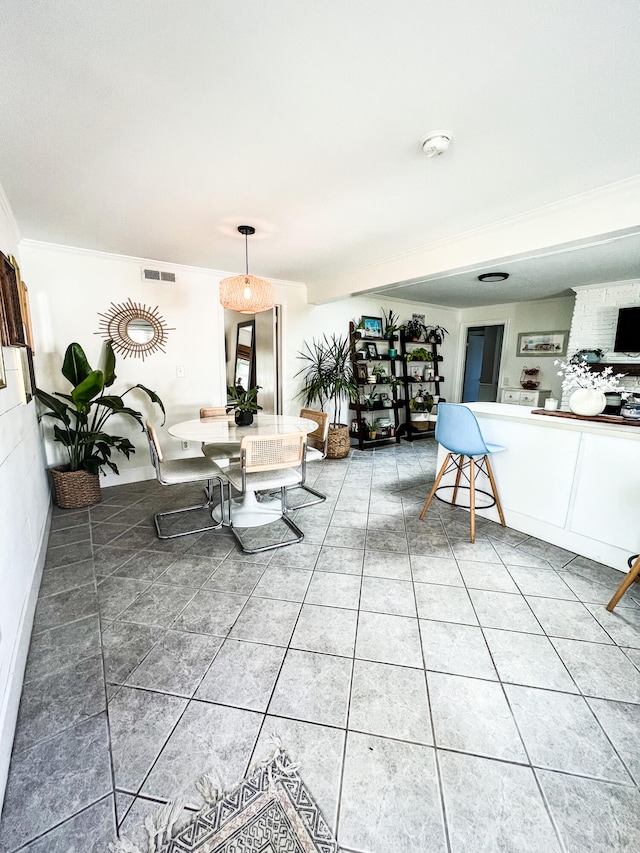 living room with tile patterned floors and crown molding