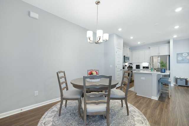 148 Omalley Dr, Summerville, SC 29483 - dining area with baseboards, a notable chandelier, recessed lighting, and dark wood-style flooring