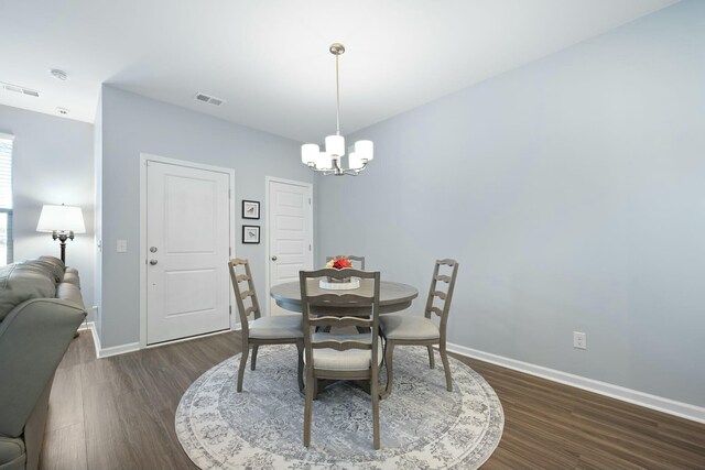 148 Omalley Dr, Summerville, SC 29483 - dining area with baseboards, a notable chandelier, visible vents, and dark wood-style flooring