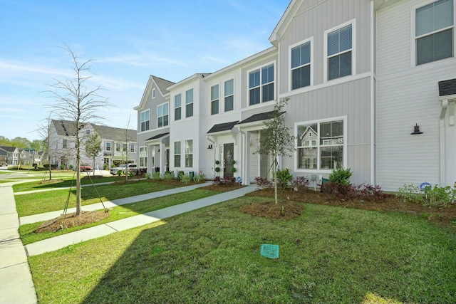 148 Omalley Dr, Summerville, SC 29483 - multi unit property featuring a front lawn, board and batten siding, and a residential view