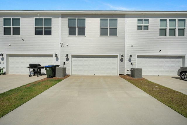 148 Omalley Dr, Summerville, SC 29483 - view of side of home featuring an attached garage, central AC unit, and concrete driveway
