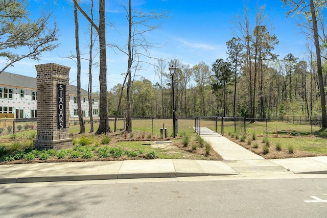 148 Omalley Dr, Summerville, SC 29483 - view of home's community featuring a gate, fence, and a wooded view