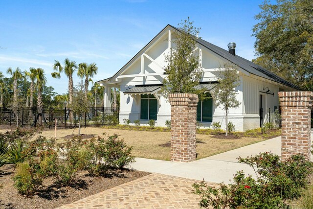 148 Omalley Dr, Summerville, SC 29483 - view of front of home featuring a front yard, fence, and brick siding