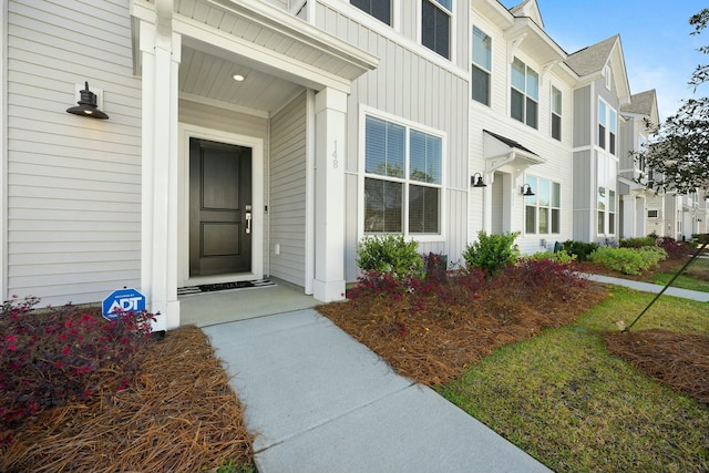 148 Omalley Dr, Summerville, SC 29483 - entrance to property featuring board and batten siding, roof with shingles, and a residential view
