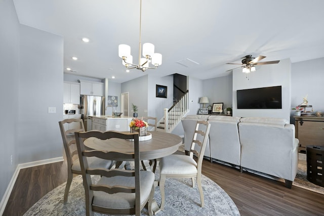 148 Omalley Dr, Summerville, SC 29483 - dining space featuring dark wood-type flooring, baseboards, stairway, and ceiling fan with notable chandelier