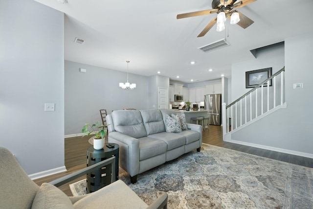 148 Omalley Dr, Summerville, SC 29483 - living area with visible vents, wood finished floors, stairway, and ceiling fan with notable chandelier