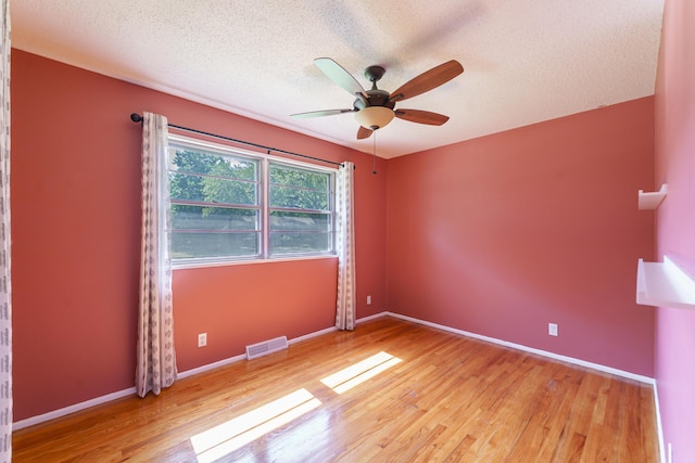 7 Plainfield Dr, Charleston, SC 29407 - unfurnished room featuring wood finished floors, a ceiling fan, and a textured ceiling