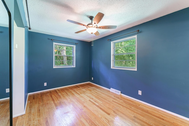 7 Plainfield Dr, Charleston, SC 29407 - empty room with a textured ceiling, a ceiling fan, and wood finished floors