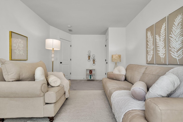 living area with carpet flooring and baseboards