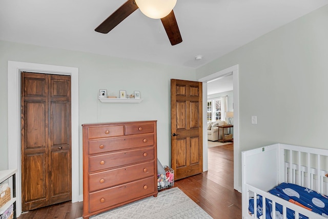 bedroom featuring dark wood-style floors and ceiling fan