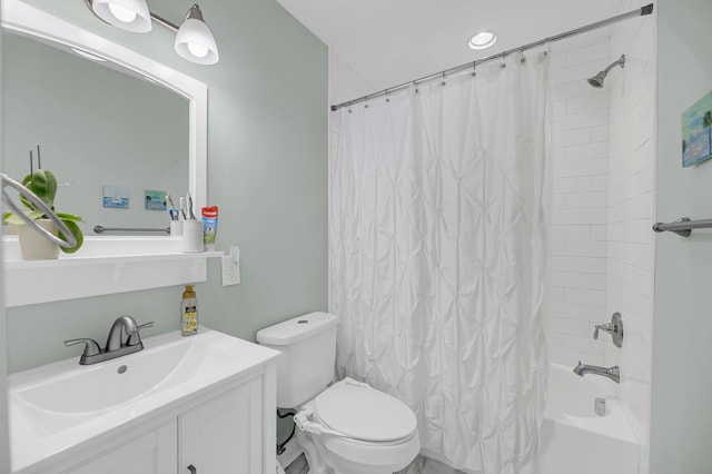 full bath with toilet, shower / tub combo, and vanity