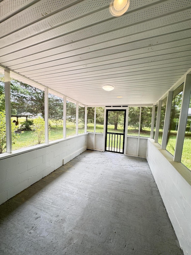unfurnished sunroom with healthy amount of natural light