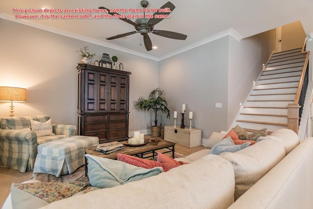 living room with hardwood / wood-style flooring, ornamental molding, and ceiling fan