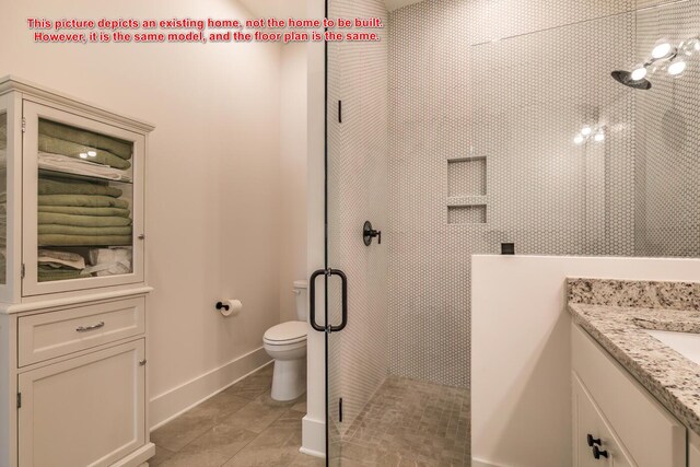 bathroom with vanity, toilet, an enclosed shower, and tile patterned flooring