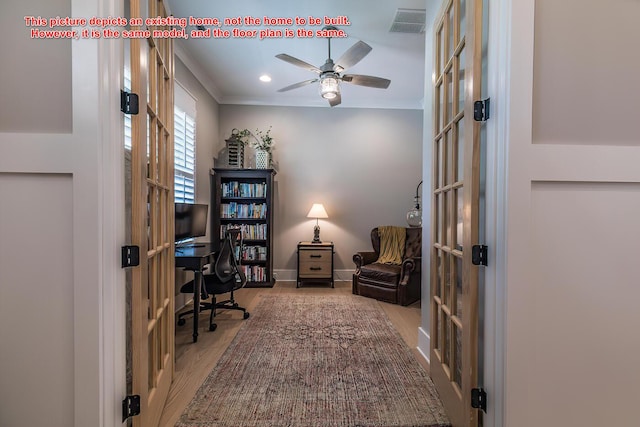 office space featuring french doors, ceiling fan, ornamental molding, and light hardwood / wood-style flooring