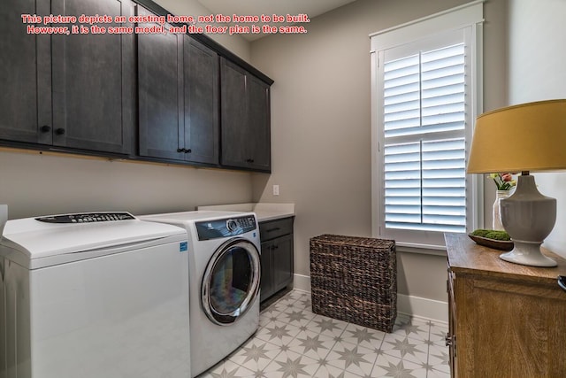 laundry room with cabinets and washing machine and dryer