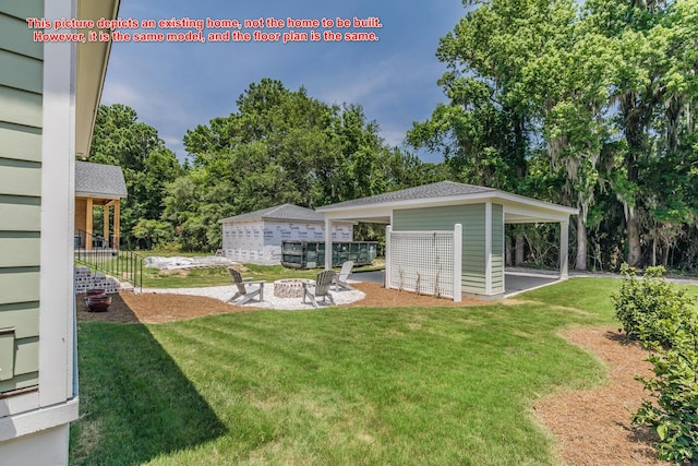 view of yard featuring a fire pit